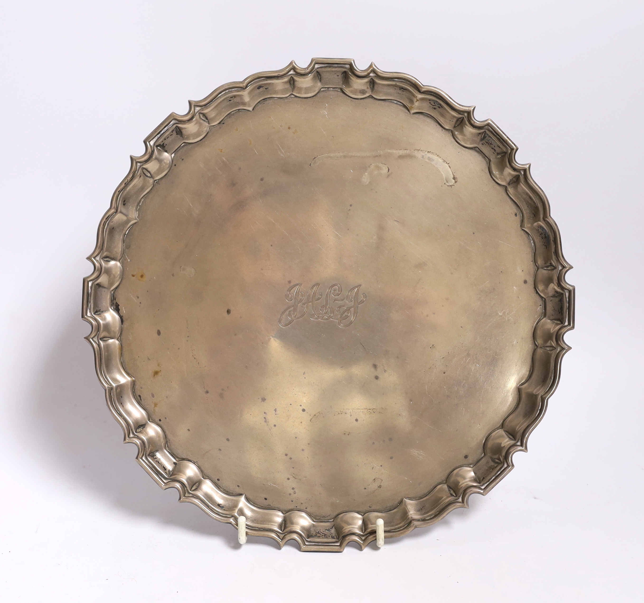 A George VI monogrammed silver salver with piecrust border, Chester, 1939 by Jay, Richard Attenborough Co Ltd, 25.4cm, 20.4oz.